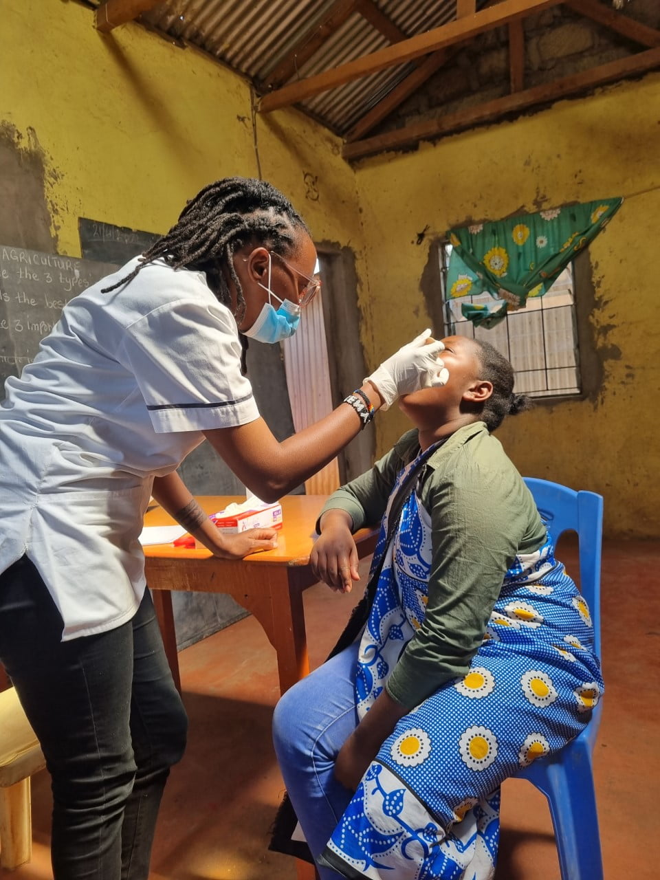 A medical professional examining a patient